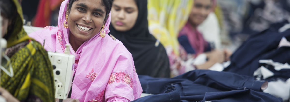 Bangladesh woman in garment factory smiling