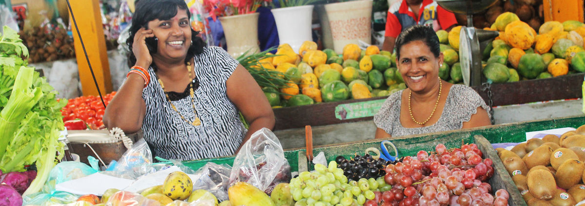women on phone at market