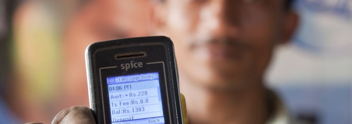 GCE IO, closeup of cell phone man holding at arms length