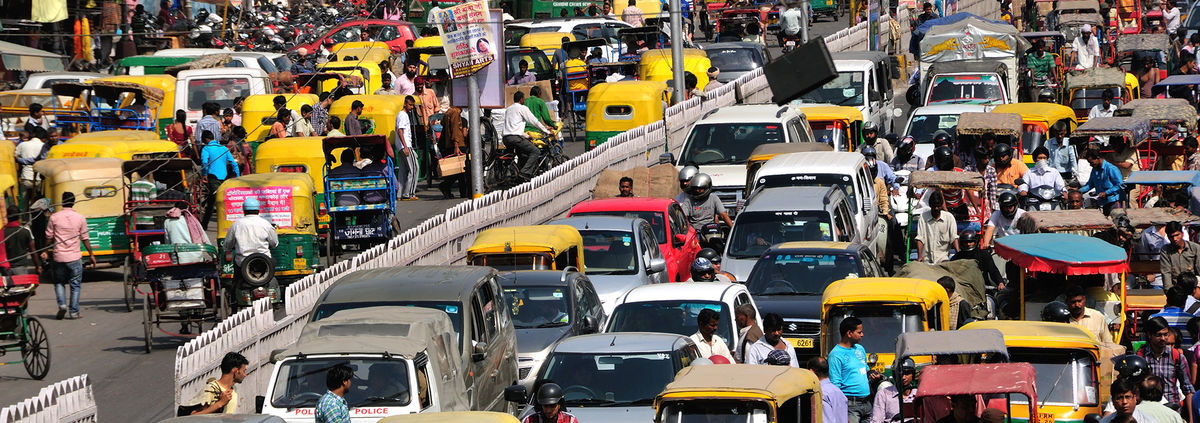 Many cars, auto rickshaws, people cause heavy traffic jam as usual on Chandni Chowk street in Old Delhi